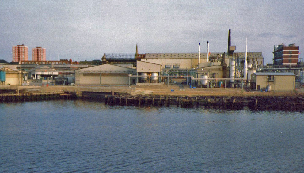 Image of 1980's view of Palmers Engine Works from river.