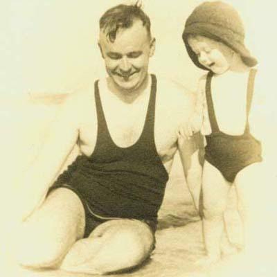 Image of 1939: Teaching his son Philip to swim.